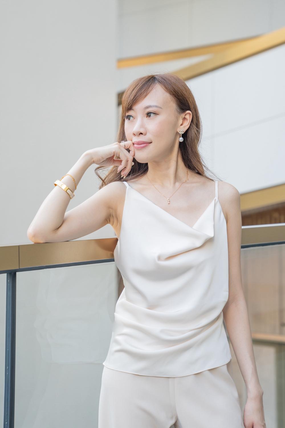 HESTIA’S slim-waisted asymmetrical drape vest (Creamy Pearl)